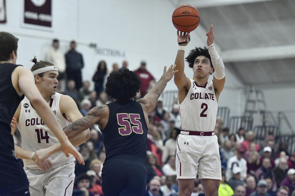 Colgate guard Braeden Smith (2) takes a shot over Lafayette forward Josh Rivera (55) during the first half of an NCAA college basketball game for the Patriot League tournament championship in Hamilton, N.Y., Wednesday, March 8, 2023. (AP Photo/Adrian Kraus)