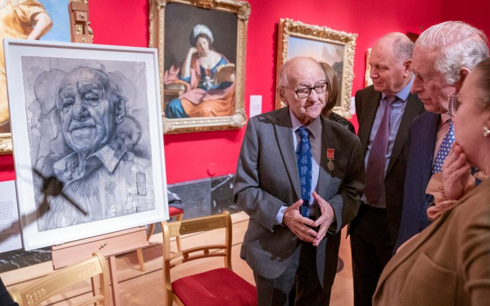 Holocaust survivor Zigi Shipper with his portrait at the Queen’s Gallery, Buckingham Palace - Arthur Edwards
