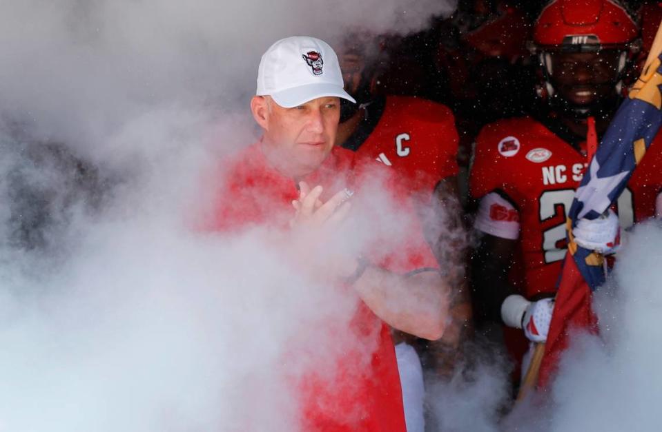 N.C. State head coach Dave Doeren leads his team out onto the field before the Wolfpack’s game against VMI at Carter-Finley Stadium in Raleigh, N.C., Saturday, Sept. 16, 2023.