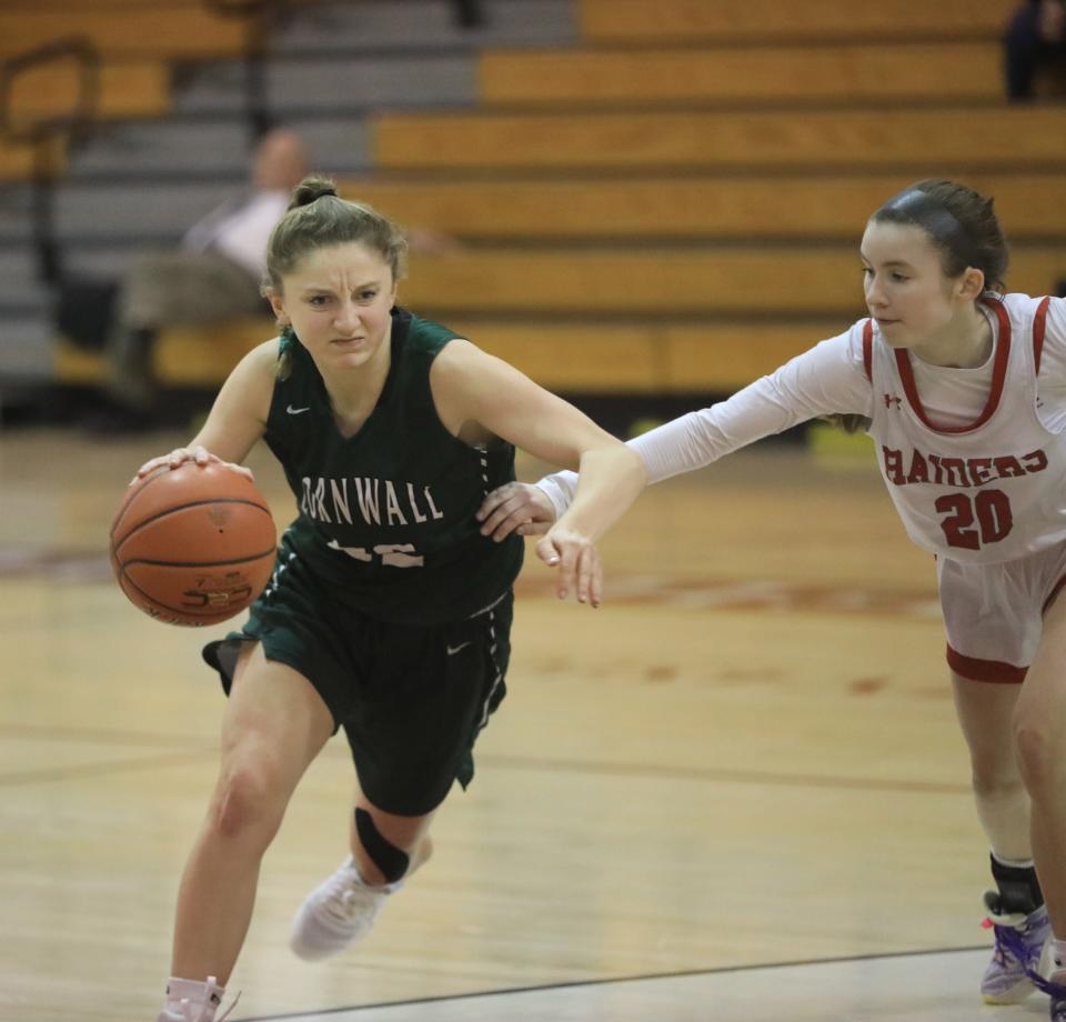 Red Hook's Maddie Clements guards Cornwall's Kate Vitale as she drives toward the basketball during a Dec. 14, 2023 girls basketball game.