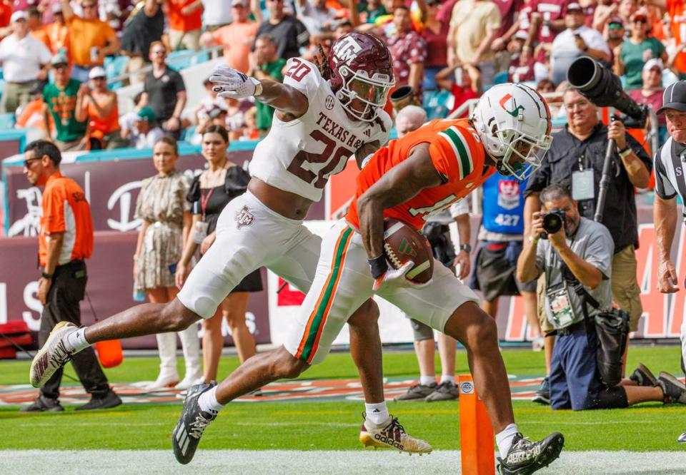 Miami Hurricanes wide receiver Isaiah Horton (16) scores a touchdown Texas A&M Aggies defensive back Jardin Gilbert (20) defends during the second quarter of an NCAA non conference game at Hard Rock Stadium on Saturday, Sept. 9, 2023 in Miami Gardens, Florida.