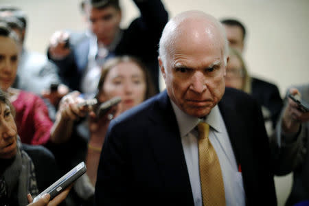 U.S. Senator John McCain (R-AZ) talks to reporters as he arrives for the weekly Republican party caucus luncheon at the U.S. Capitol in Washington, U.S. October 31, 2017. REUTERS/Jonathan Ernst