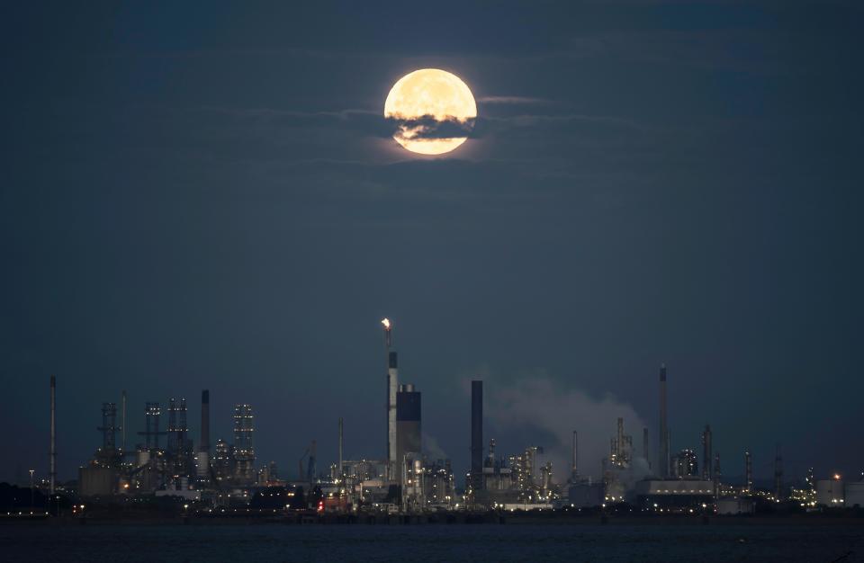 The super blue moon sets behind the Humber Refinery in South Killingholme. The blue moon refers to the second full moon in one calendar month, which occurs approximately once every two or three years. This one is also supermoon - when the Earth's natural satellite will appear about 14% bigger and 30% brighter in the sky as it reaches its closest point to Earth. Picture date: Thursday August 31, 2023.