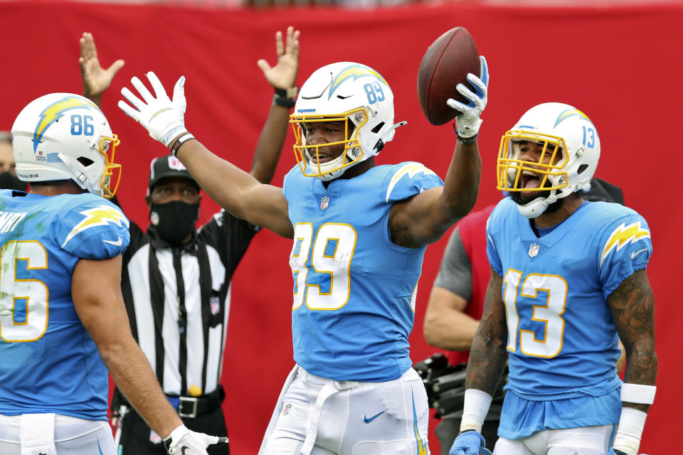 Los Angeles Chargers tight end Donald Parham Jr. (89) celebrates with tight end Hunter Henry (86) and wide receiver Keenan Allen (13) after Parham scored against the Tampa Bay Buccaneers during the first half of an NFL football game Sunday, Oct. 4, 2020, in Tampa, Fla. (AP Photo/Mark LoMoglio)