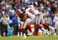 <p>Mark Sanchez #6 of the Washington Redskins is sacked by outside linebacker Olivier Vernon #54 and linebacker Lorenzo Carter #59 of the New York Giants in the second quarter at FedExField on December 9, 2018 in Landover, Maryland. (Photo by Patrick Smith/Getty Images) </p>