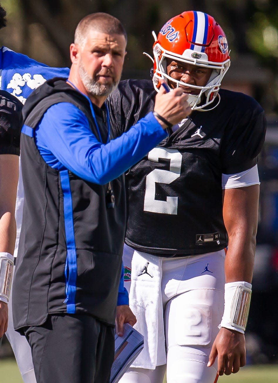 Florida Gators quarterback DJ Lagway (2) listens to Florida Gators head coach Billy Napier during University of Florida Gators’ Spring football practice at Sanders Practice Fields in Gainesville, FL on Thursday, March 28, 2024. [Doug Engle/Gainesville Sun]