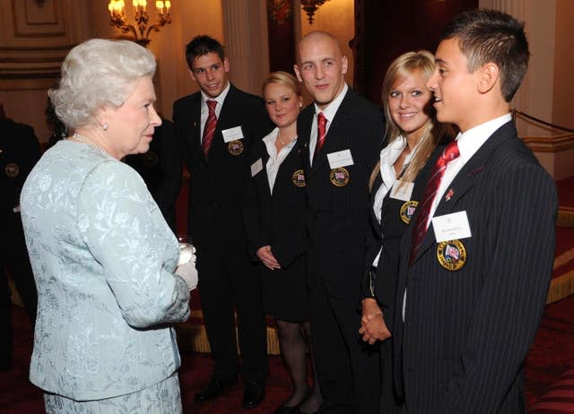 Tom Daley met the late Queen on a previous visit to Buckingham Palace (Stefan Rousseau/PA)