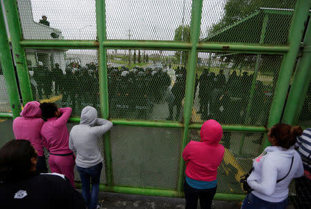 Relatives of inmates wait for news of their loved ones outside the Cadereyta state prison after a riot broke out at the prison, in Cadereyta Jimenez, on the outskirts of Monterrey, Mexico October 11, 2017. REUTERS/Daniel Becerril