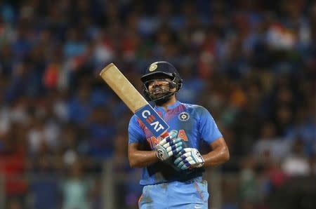 Cricket - West Indies v India - World Twenty20 cricket tournament semi-final - Mumbai, India - 31/03/2016. India's Rohit Sharma watches the ball after playing a shot. REUTERS/Danish Siddiqui