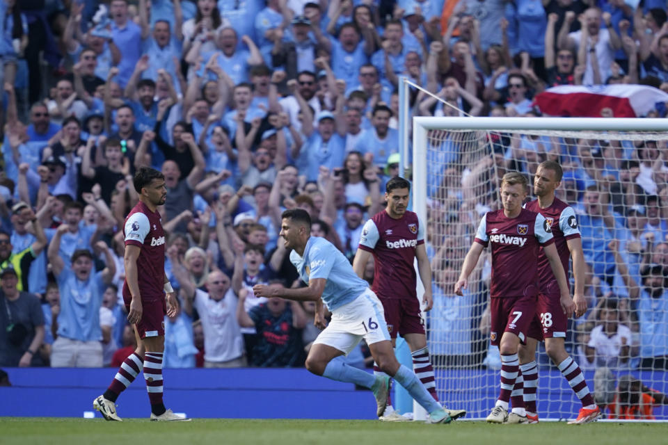 Manchester City's Rodrigo, second left, celebrates after scoring his side's third goal during the English Premier League soccer match between Manchester City and West Ham United at the Etihad Stadium in Manchester, England, Sunday, May 19, 2024. (AP Photo/Dave Thompson)