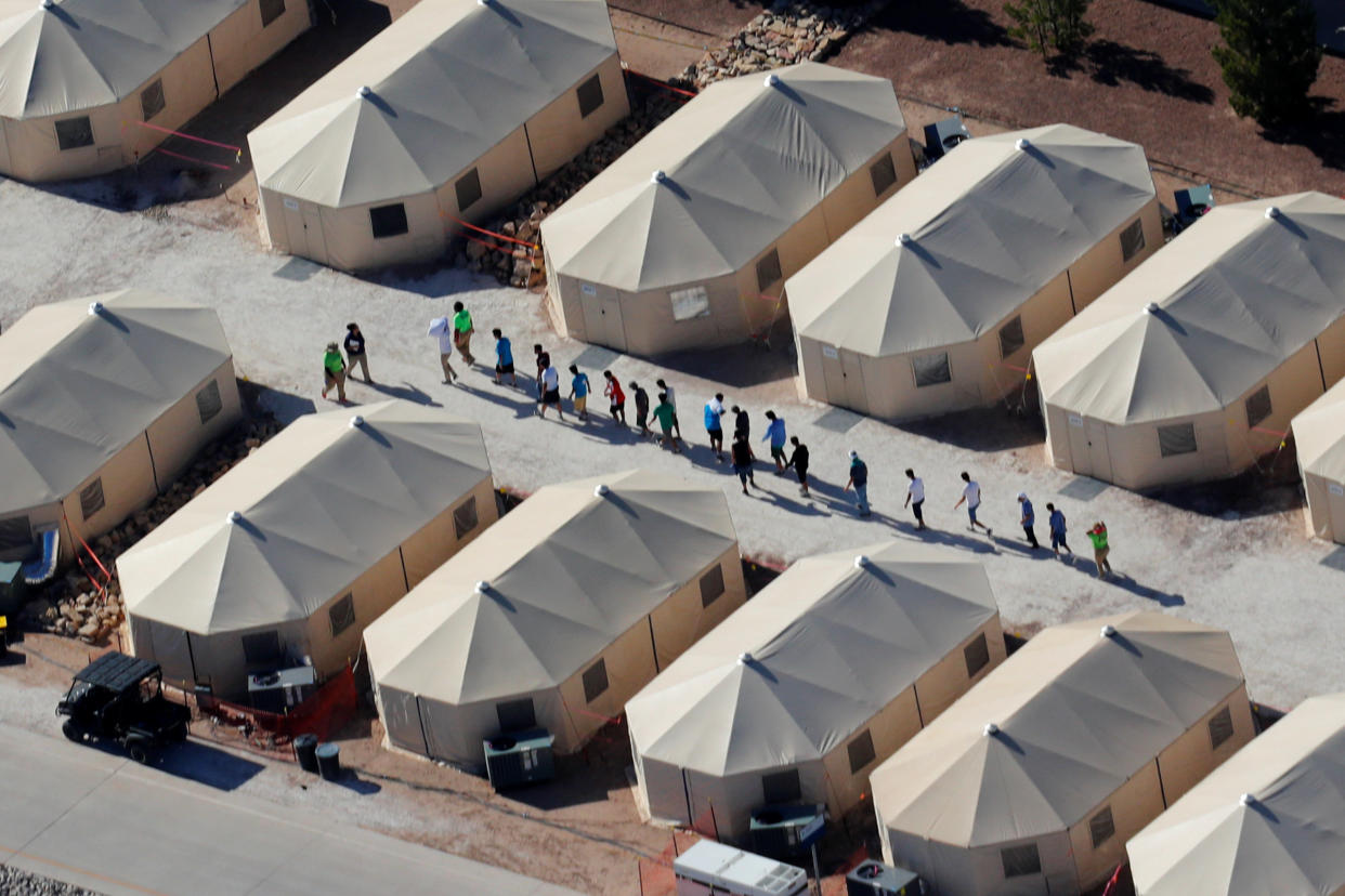Immigrant children shown walking in single file at the Tornillo, Texas, tent city on June 19, 2018. (Photo: Mike Blake/Reuters)