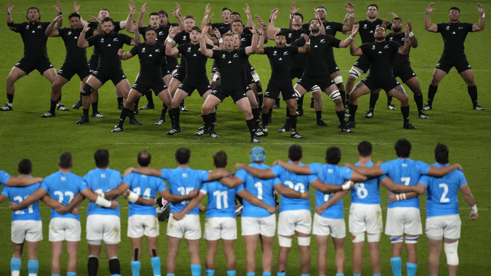 New Zealand's players perform Haka ahead of the Rugby World Cup Pool A match between New Zealand and Uruguay at the OL Stadium, in Lyon, France Thursday, Oct. 5, 2023. (AP Photo/Pavel Golovkin)