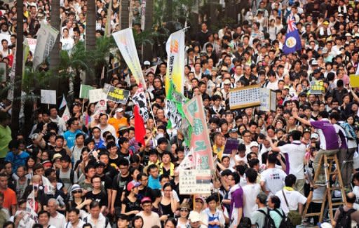 Thousands of protesters take to the streets calling for universal suffrage and chanting slogans against new Hong Kong Chief Executive Leung Chun-ying in Hong Kong only hours after Chinese President Hu Jintao completed his three-day visit to the southern Chinese territory. Chinese web users accused Jintao of "hiding" from protesters in Hong Kong Sunday even as state media covered the anniversary