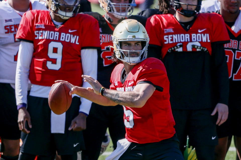 National quarterback Sam Hartman, of Notre Dame, throws a pass during practice for the Senior Bowl NCAA college football game, Tuesday, Jan. 30, 2024, in Mobile, Ala. (AP Photo/ Butch Dill)