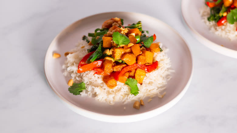 butternut squash stir-fry with garnishes on plate 