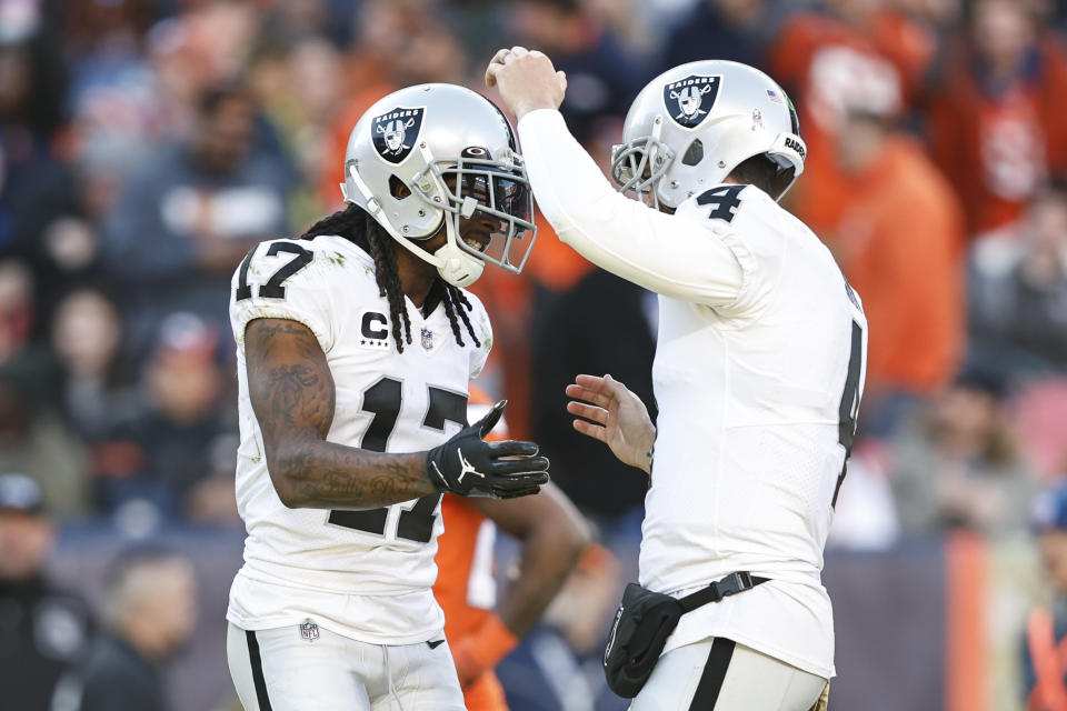 Derek Carr (right) celebrates with Davante Adams (left).