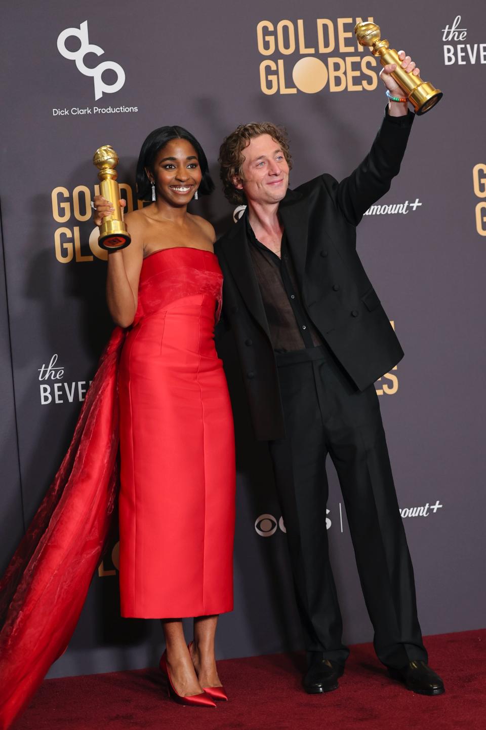 Ayo Edibiri, Jeremy Allen White, Calvin Klein, boots, black boots, leather boots, mens boots, suit, black suit, sheer shirt, gold jewelry, Jamie Mizrahi, Golden Globe Awards, Golden Globes, red carpet, celebrity red carpet, awards