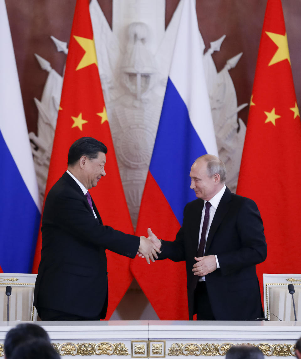 Russian President Vladimir Putin, right, and Chinese President Xi Jinping shake hands after a signing ceremony following their talks in the Kremlin in Moscow, Russia, Wednesday, June 5, 2019. Chinese President Xi Jinping is on visit to Russia this week and is expected to attend Russia's main economic conference in St. Petersburg. (AP Photo/Alexander Zemlianichenko, Pool)