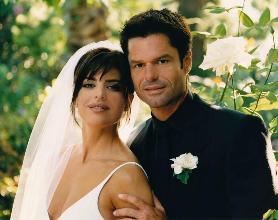 Lisa Rinna and Harry Hamlin pose for a photo after their wedding at their home on March 29, 1997 in Beverly Hills, California