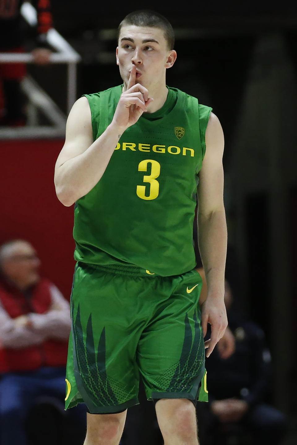 Oregon guard Payton Pritchard (3) silences the crowd after a 3-pointer against Utah in the second half during an NCAA college basketball game Saturday, Jan. 4, 2020, in Salt Lake City. (AP Photo/Rick Bowmer)