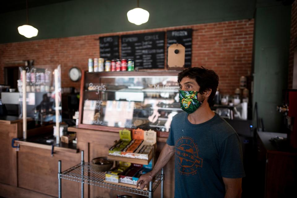 Kelly Lyda, owner of the Aspen Cafe, stands in his Cafe on May 5, 2020 in Stillwater, Oklahoma. - In the face of intimidation against employees and the threat of an armed attack by local residents wielding their individual liberties, the mayor of Stillwater had to give in: he gave up imposing the wearing of masks on customers in shops. This demand was included in a 21-page document that was supposed to accompany the gradual reopening of restaurants and shops from 1 May, as authorized by the state of Oklahoma. "About three and a half hours after the law came into effect" of the text, "we started receiving calls from stores claiming that employees were being threatened and insulted, and threatened with physical violence," said Norman McNickle, the city's director of services. (Photo by Johannes EISELE / AFP) (Photo by JOHANNES EISELE/AFP via Getty Images)