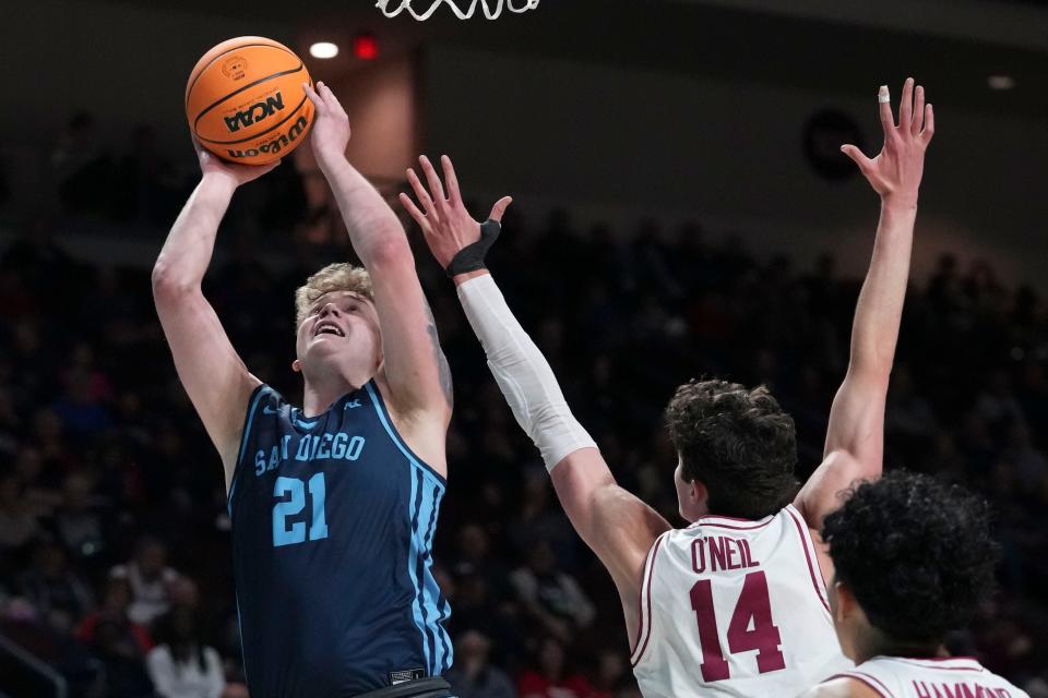 March 9, 2024; Las Vegas, NV, USA; San Diego Toreros forward PJ Hayes (21) shoots the basketball against Santa Clara Broncos forward Johnny O'Neil (14) during the first half in the quarterfinals of the WCC Basketball Championship at Orleans Arena. Mandatory Credit: Kyle Terada-USA TODAY Sports