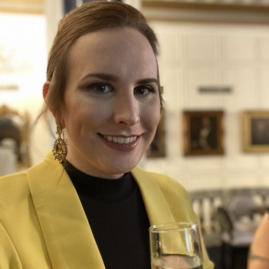 beauty pageant contestant Anita Green holding a glass