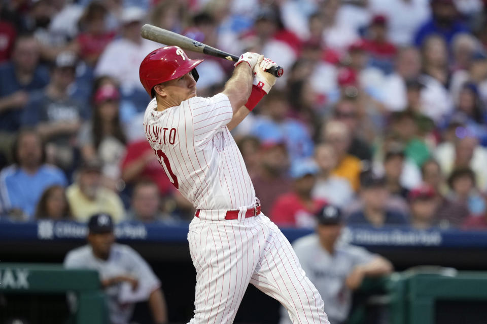 Philadelphia Phillies' J.T. Realmuto follows through after hitting a run-scoring single against Minnesota Twins pitcher Dallas Keuchel during the second inning of a baseball game, Friday, Aug. 11, 2023, in Philadelphia. (AP Photo/Matt Slocum)