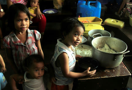 Children celebrate Christmas Day at the evacuation center before Typhoon Nock-ten is expected to strike Legazpi City, Albay province, central Philippines December 25, 2016. REUTERS/Stringer