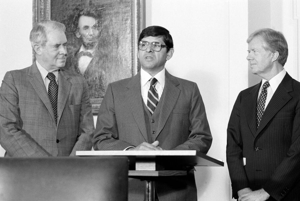 President Carter, Cyrus Vance and Julian Nava speak to reporters