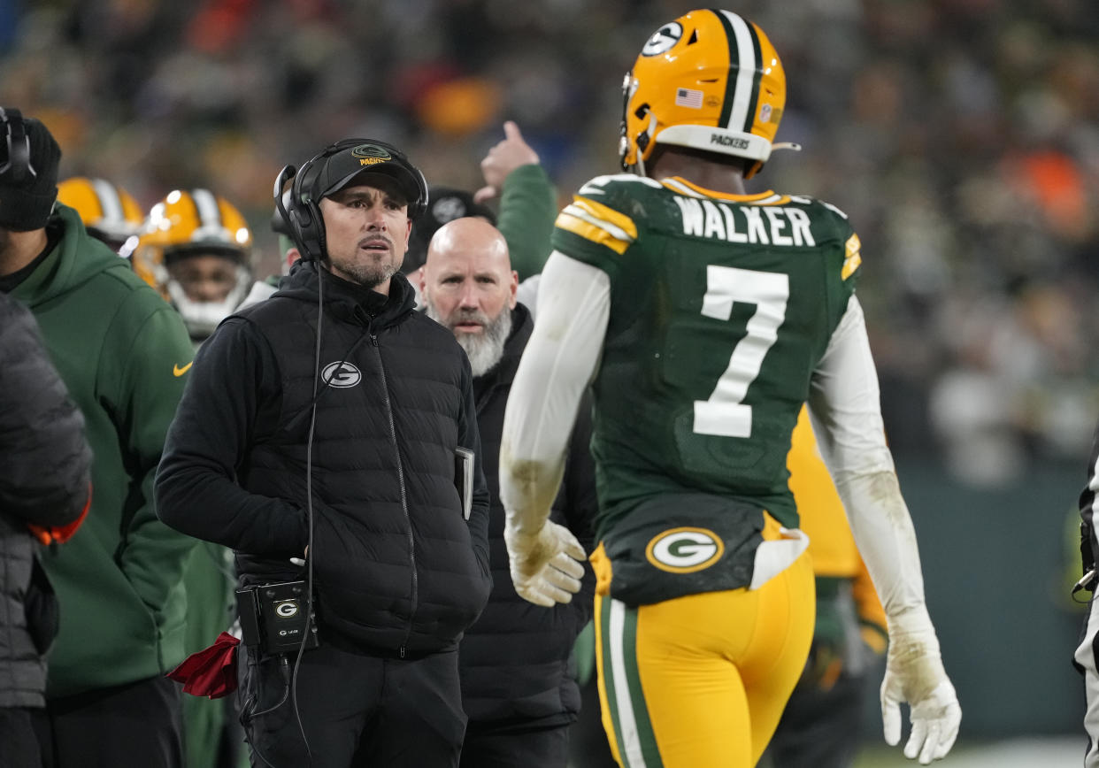 GREEN BAY, WISCONSIN - JANUARY 08: Head coach Matt LaFleur of the Green Bay Packers talks with Quay Walker #7 after he was disqualified for an unsportsmanlike penalty during the fourth quarter against the Detroit Lions at Lambeau Field on January 08, 2023 in Green Bay, Wisconsin. (Photo by Patrick McDermott/Getty Images)