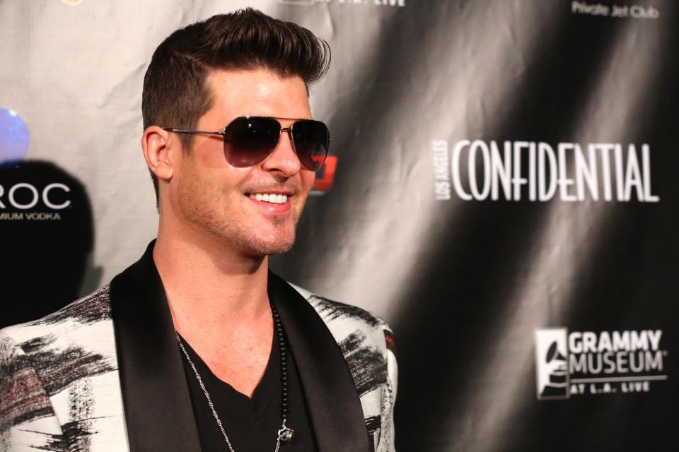 Robin Thicke arrives Friday Jan. 24, 2014, to the Los Angeles Confidential magazine, CBS Radio and the GRAMMY Museum at L.A. LIVE to celebrate The Grammys in Los Angeles. (Photo by Alexandra Wyman/Invision/AP))