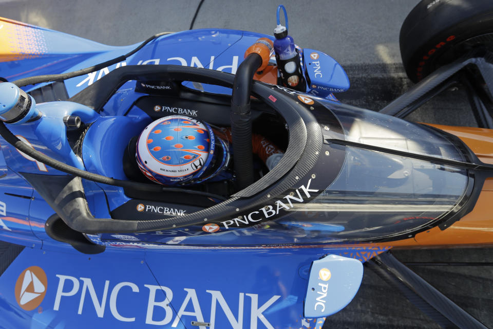 Scott Dixon, of New Zealand, sits in his car during the Aeroscreen testing at Indianapolis Motor Speedway, Wednesday, Oct. 2, 2019, in Indianapolis. (AP Photo/Darron Cummings)