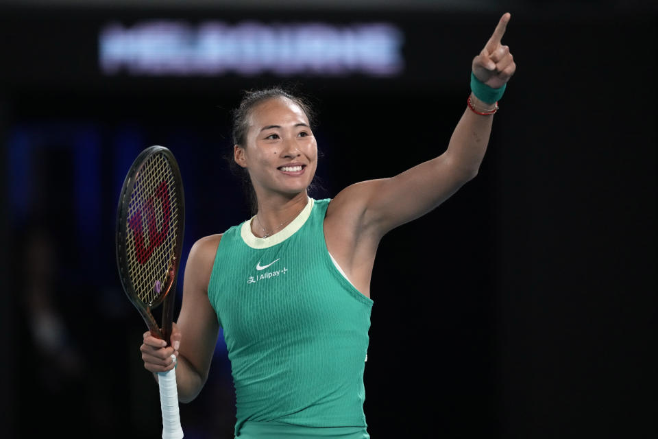 Zheng Qinwen of China reacts after defeating Anna Kalinskaya of Russia in their quarterfinal match at the Australian Open tennis championships at Melbourne Park, Melbourne, Australia, Wednesday, Jan. 24, 2024. (AP Photo/Louise Delmotte)