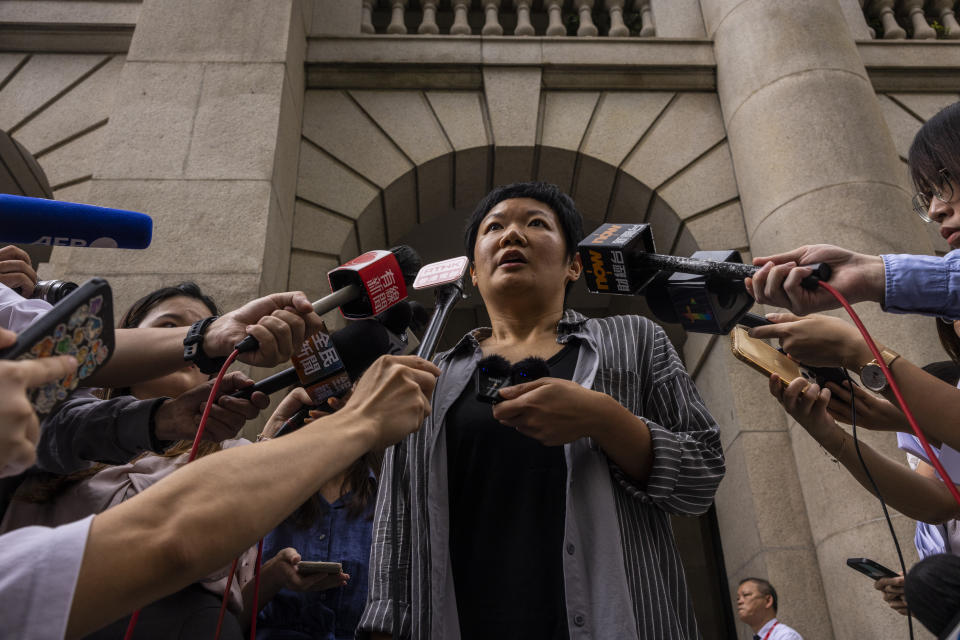 Journalist Bao Choy speaks to members of the press after being cleared by top Hong Kong court in Hong Kong, Monday, June 5 2023. The award-winning Hong Kong journalist won an appeal quashing her conviction related to work on her investigative documentary Monday in a rare court ruling upholding media freedom in the territory. (AP Photo/Louise Delmotte)