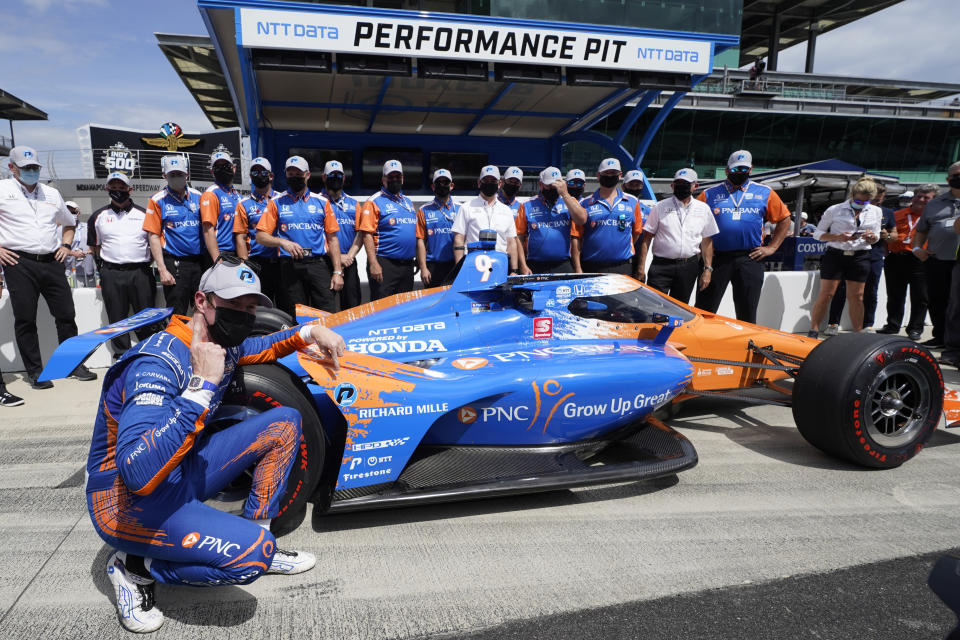 Scott Dixon, of New Zealand, celebrates after winning the pole for the Indianapolis 500 auto race at Indianapolis Motor Speedway, Sunday, May 23, 2021, in Indianapolis. (AP Photo/Darron Cummings)