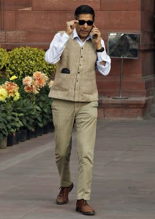 Chief economic adviser at India's Finance Ministry, Arvind Subramanian, speaks on a mobile phone outside his office ahead of the presentation of the 2015/16 federal budget in New Delhi February 28, 2015. REUTERS/Vijay Mathur