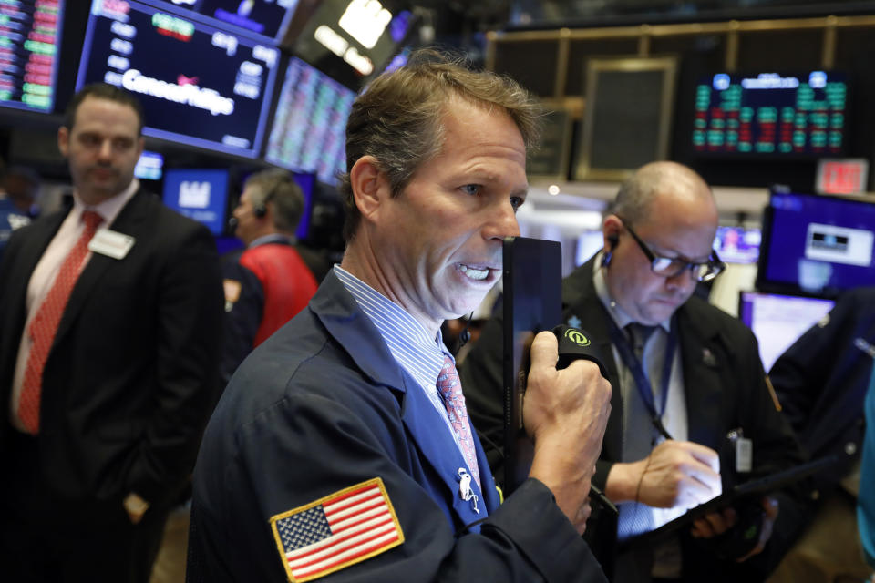 Trader Robert Chamak works on the floor of the New York Stock Exchange, Wednesday, June 19, 2019. Investors are in wait-and-see mode hours ahead of a widely anticipated Federal Reserve decision on interest rates. (AP Photo/Richard Drew)