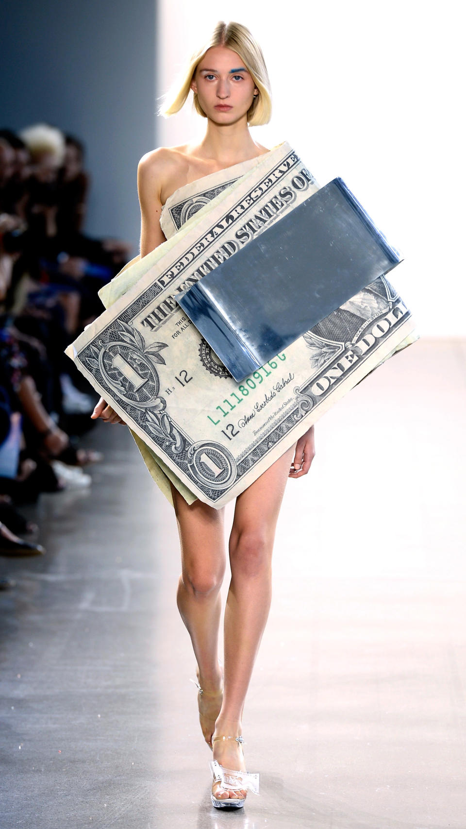 Designer Kota Okuda sent models down the runway in looks like this one, meant to redefine American currency "<a href="https://www.instagram.com/p/BnkPwAaliBu/?hl=en&amp;taken-by=kotaokuda" target="_blank" rel="noopener noreferrer">by commodifying its value in an alchemistic system of dress</a>&rdquo; on Sept. 7.&nbsp;