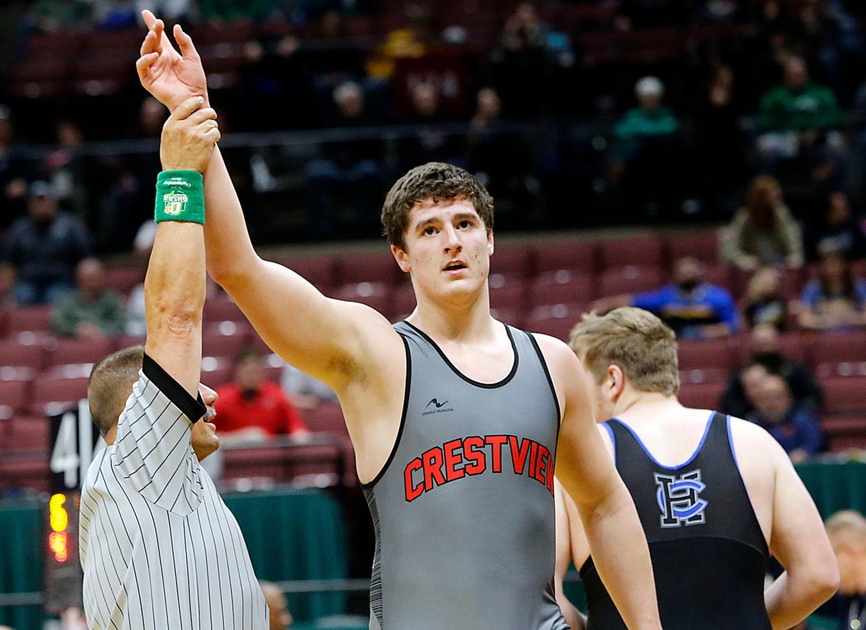 Crestview’s Caleb Cunningham has his arm raised after pinning Harrison Central’s Landen Thomas in the first period during their 285lbs Division III championship match at the OHSAA State Wrestling Championships Sunday, March 10, 2024 at the Jerome Schottenstein Center. TOM E. PUSKAR/MANSFIELD NEWS JOURNAL