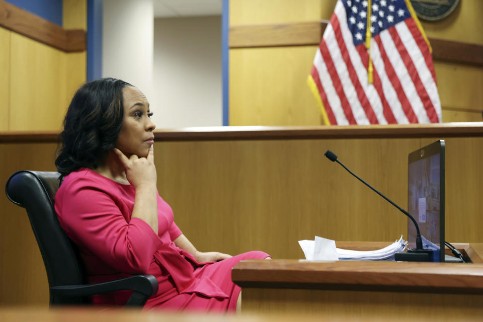 Fulton County District Attorney Fani Willis takes the stand as a witness during a hearing on the Georgia election interference case, Thursday, Feb. 15, 2024, in Atlanta.  / Credit: Alyssa Pointer / AP