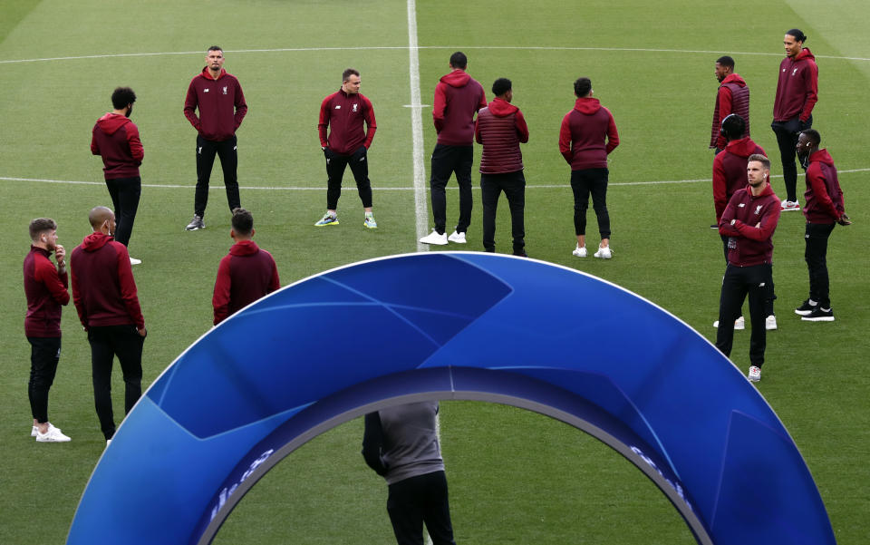 Liverpool's players inspect the pitch at the Camp Nou stadium in Barcelona, Spain, Tuesday, April 30, 2019. FC Barcelona will play against Liverpool in a first leg semifinal Champions League soccer match on Wednesday, May 1. (AP Photo/Manu Fernandez)