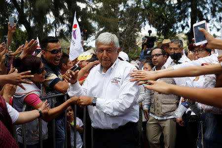 Leftist front-runner Andres Manuel Lopez Obrador of the National Regeneration Movement (MORENA) greets supporters as he arrives at his campaign rally in Mexico City, Mexico, June 3, 2018. REUTERS/Carlos Jasso