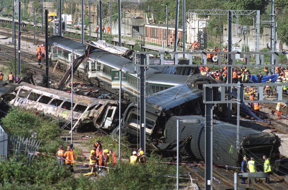 FILE - The wreckage of two railway trains lie across the tracks, following a crash near Paddington Station in west London, on Oct. 5, 1999. Rail travel in Europe is a common and relatively affordable and convenient way for many Europeans to travel. It also has a good safety record overall, growing safer in past years. Yet the tragedy in Greece on Wednesday is a reminder of how deadly crashes can be when they happen. (AP Photo/Alastair Grant, File)