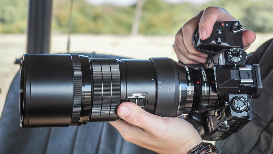 Olympus M.Zuiko 300mm f/4 IS Pro lens on Olympus OM-D E-M1X  being held by DCW Editor James Artaius