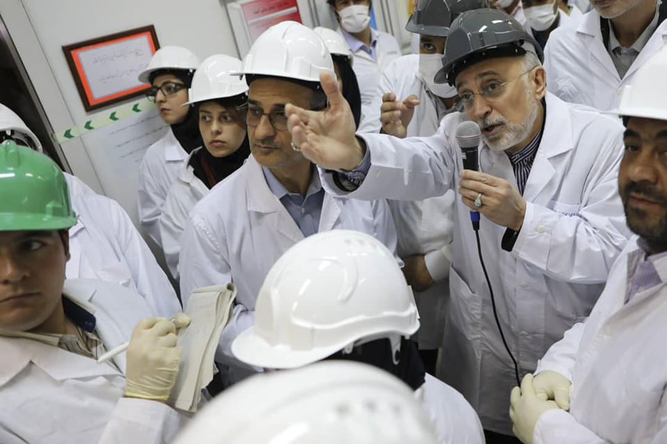 In this photo released on Monday, Nov. 4, 2019 by the Atomic Energy Organization of Iran, Ali Akbar Salehi, head of the organization, speaks with media while visiting Natanz enrichment facility, in central Iran. Iran on Monday broke further away from its collapsing 2015 nuclear deal with world powers by doubling the number of advanced centrifuges it operates, linking the decision to U.S. President Donald Trump's withdrawal from the agreement over a year ago. (Atomic Energy Organization of Iran via AP)