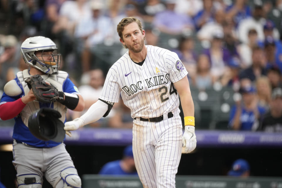 Colorado Rockies' Ryan McMahon, right, reacts after striking out as Toronto Blue Jays catcher Alejandro Kirk, left, heads to the dugout at the end of the sixth inning of a baseball game Sunday, Sept. 3, 2023, in Denver. (AP Photo/David Zalubowski)