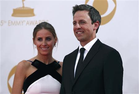 Actor Seth Meyers, from NBC's "Saturday Night Live," arrives with his wife Alexi at the 65th Primetime Emmy Awards in Los Angeles September 22, 2013. REUTERS/Mario Anzuoni (UNITED STATES - Tags: ENTERTAINMENT) (EMMYS-ARRIVALS)