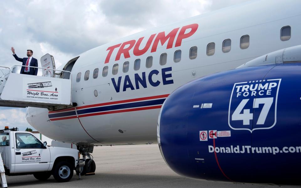 JD Vance waves as he boards Trump Force Two at Dayton International Airport, Ohio
