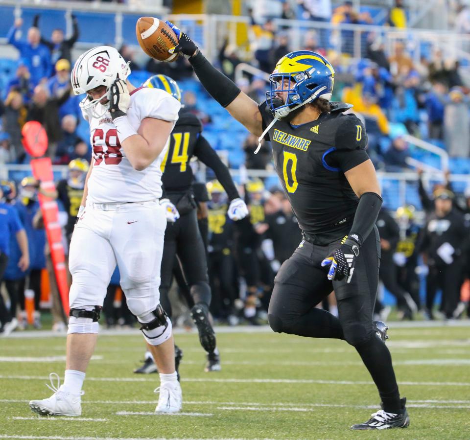 Delaware linebacker Jackson Taylor (0) celebrates after a fourth quarter fumble recovery as Lafayette's Ryder Langsdale reacts during the Blue Hens' 36-34 comeback win in the opening round of the NCAA FCS playoffs Saturday, Nov. 25, 2023 at Delaware Stadium.